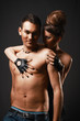 Couple in love. Happy loving couple. Dark background.