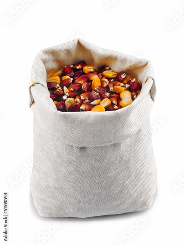 Photo: Corn grain in a burlap bag on a white background Corn grain in a burlap bag on a white background