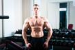 Bodybuilder posing in Gym