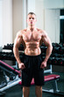 Bodybuilder posing in Gym
