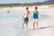 Young Couple Walking on Caribbean Beach