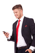 Photo: business man reads text on phone business man reads text on phone
