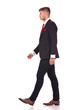 business man walks sideway
