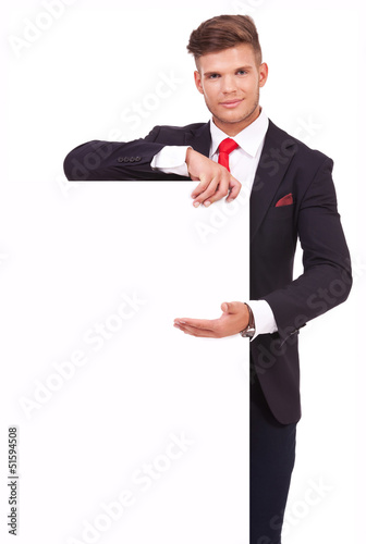 Photo: business man presents board business man presents board
