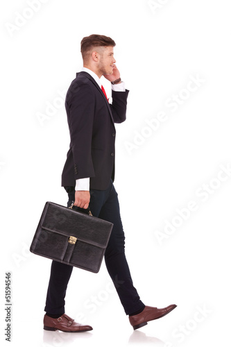 Photo: business man walks away business man walks away