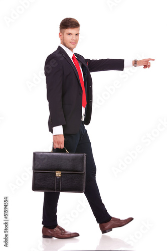 Photo: business man walking & pointing business man walking & pointing