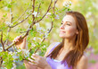Foto: Beautiful woman in spring garden Beautiful woman in spring garden