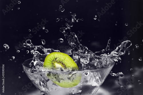 Photo: Kiwi dropped in martini glass. Kiwi dropped in martini glass.
