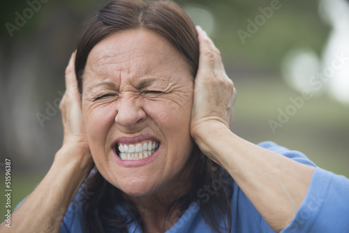 Photo: Upset stressed mature woman outdoor Upset stressed mature woman outdoor