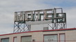 Motel sign. Pigeons landing.