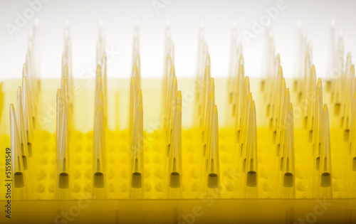 Photo: Rows of disposable laboratory dropper tips Rows of disposable laboratory dropper tips