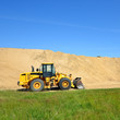 bulldozer working in sand dunes