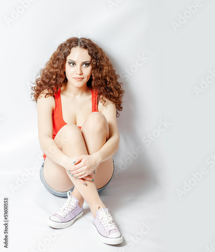Photo: Girl Sitting Down front wie sport wear Girl Sitting Down front wie sport wear