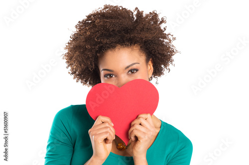 Photo: Young Girl Holding a Paper Heart in Hand Young Girl Holding a Paper Heart in Hand