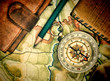compass wallet and passport on the old map