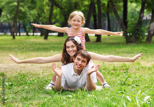 Photo: happy family having fun outdoors happy family having fun outdoors
