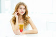 Photo: Young woman with a glass of drink Young woman with a glass of drink