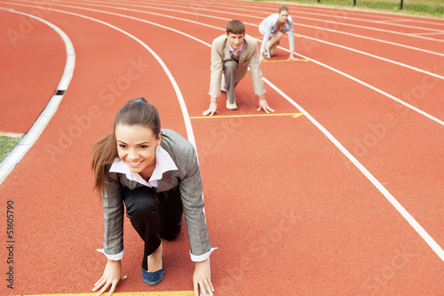 Photo: Business woman at athletic stadium Business woman at athletic stadium
