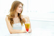 Photo: Young woman with a glass of drink Young woman with a glass of drink