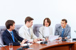 Four businesspeople at meeting