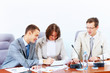 Three businesspeople at meeting
