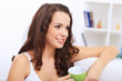 Young pretty woman in white at home