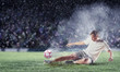 Photo: football player striking the ball football player striking the ball