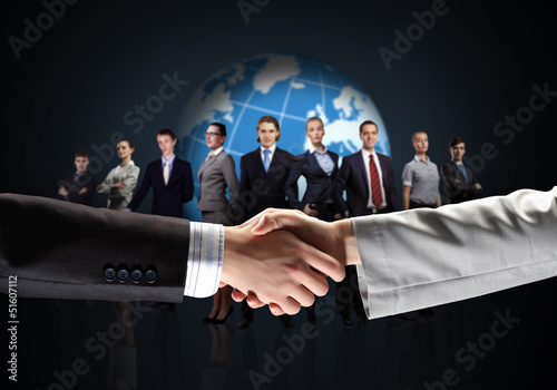 Photo: image of business handshake image of business handshake