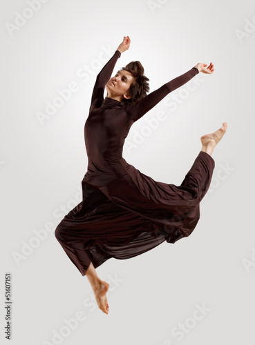 Photo: Girl in dark dress dancing Girl in dark dress dancing