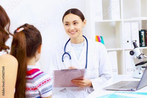 Photo: Little girl and a doctor Little girl and a doctor