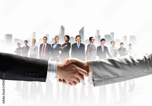 Photo: image of business handshake image of business handshake
