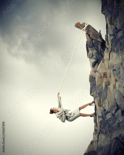 Photo: businesswoman climbing mountain businesswoman climbing mountain