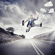 Businessman running on the road