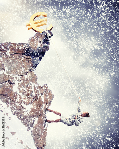 Photo: businesswoman climbing mountain businesswoman climbing mountain