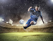 football player striking the ball