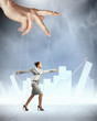 Business woman marionette