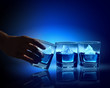 Three glasses of blue liquid