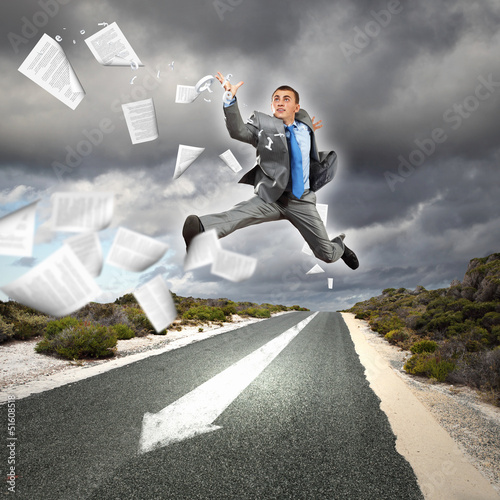 Photo: Businessman running on the road Businessman running on the road