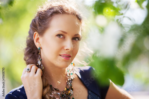 Photo: Beautiful woman in a spring garden Beautiful woman in a spring garden