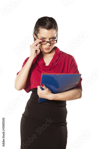 Photo: girl with a folder in her hands posing on white background girl with a folder in her hands posing on white background