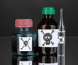 Deadly poison in bottles on black background