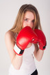 Photo: Pretty girl with boxing gloves Pretty girl with boxing gloves