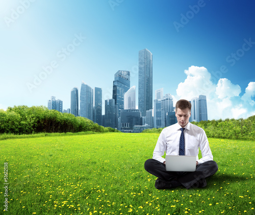Photo: business man working in park business man working in park