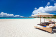 Chairs and umbrellas on tropical beach