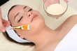 Beautiful young woman in cosmetic salon close up