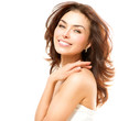 Beautiful Young Woman touching Her Skin. Portrait over White