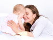 Mother and Baby kissing and hugging. Happy Family