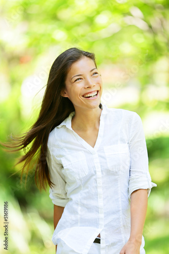 Photo: Joyful woman in a spring or summer park Joyful woman in a spring or summer park