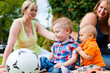 Mother and grandmother with children in a park