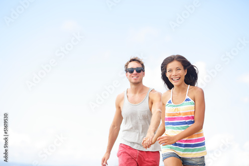 Photo: Couple having fun laughing in love outside Couple having fun laughing in love outside